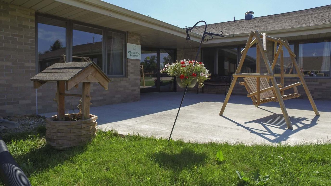 Outdoor area with swing and flower planter