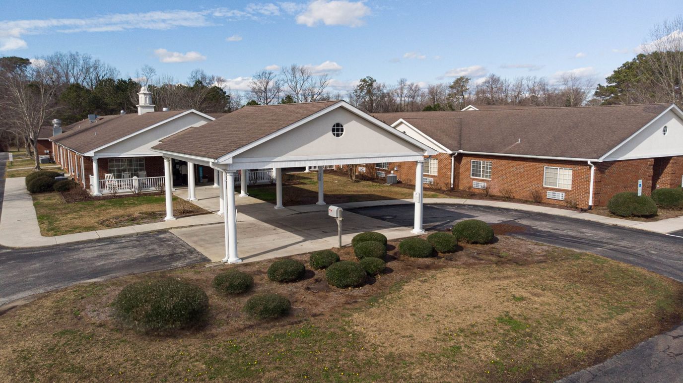 Aerial view of the facility entrance with well-maintained landscaping