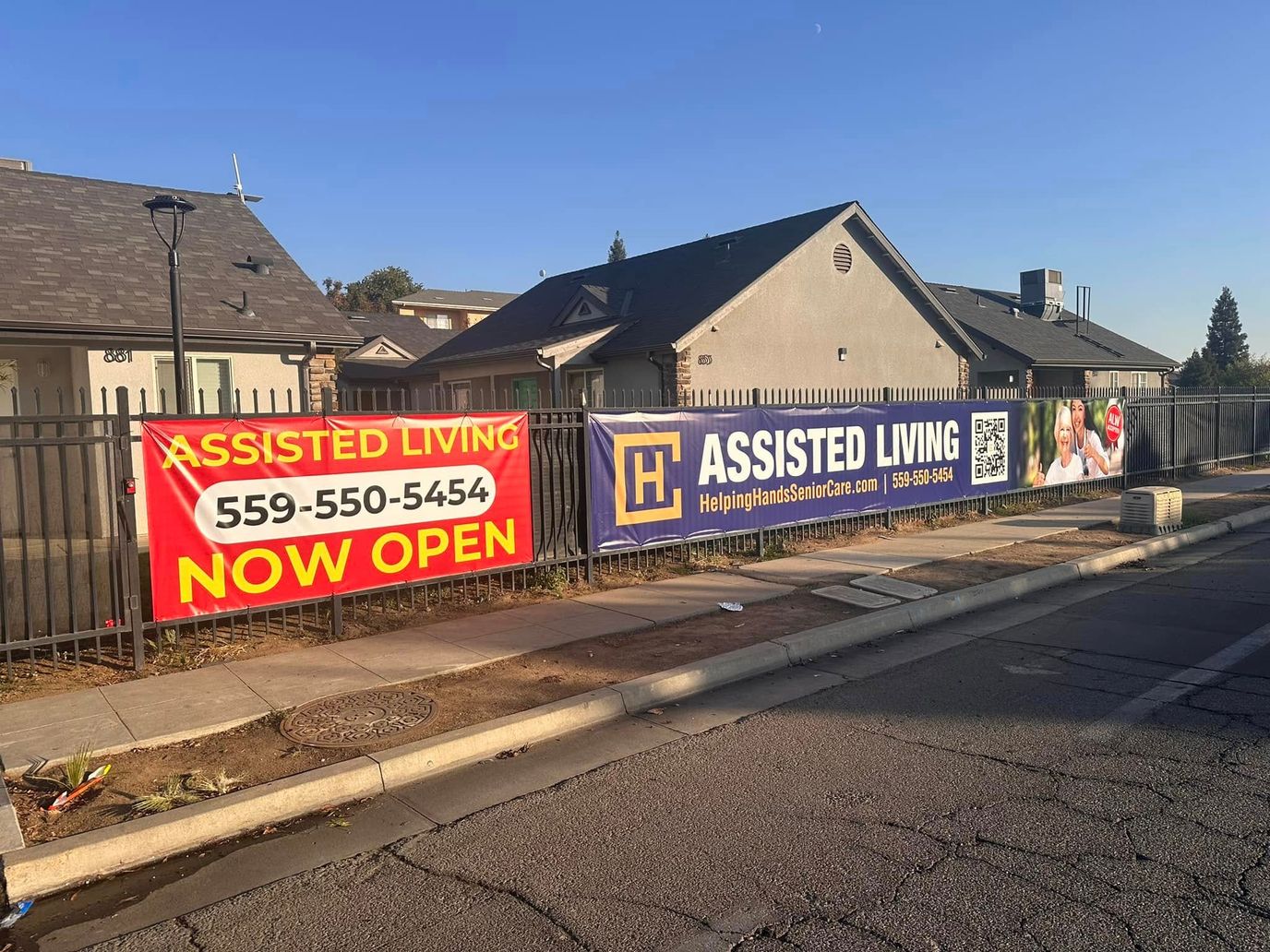 Exterior view of Assisted Living facility with banners