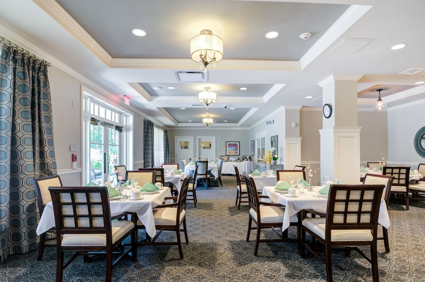 Elegant dining room setup with tables and chairs