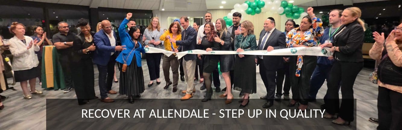 Residents and staff celebrating at a ribbon-cutting event.