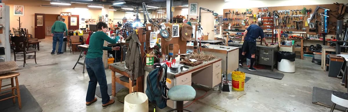 Residents engaged in woodworking activities in the workshop