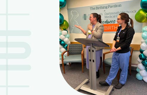 Staff presenting in a facility event space