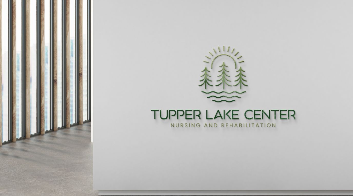 Facility logo on a light wall near windows