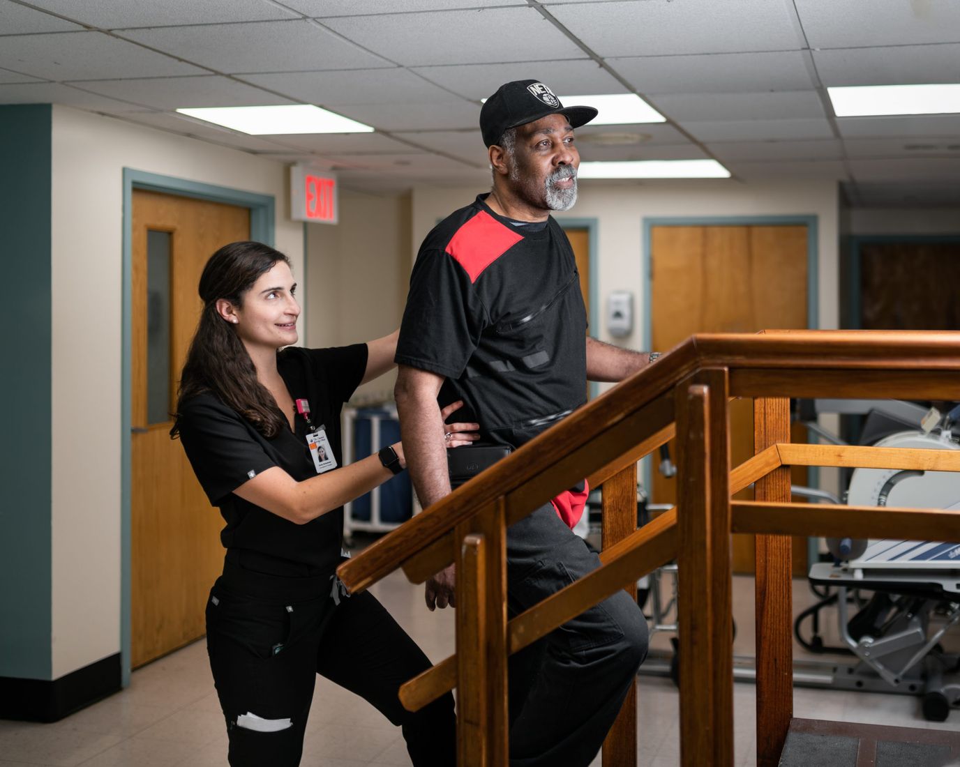 Therapist assisting a resident during rehabilitation