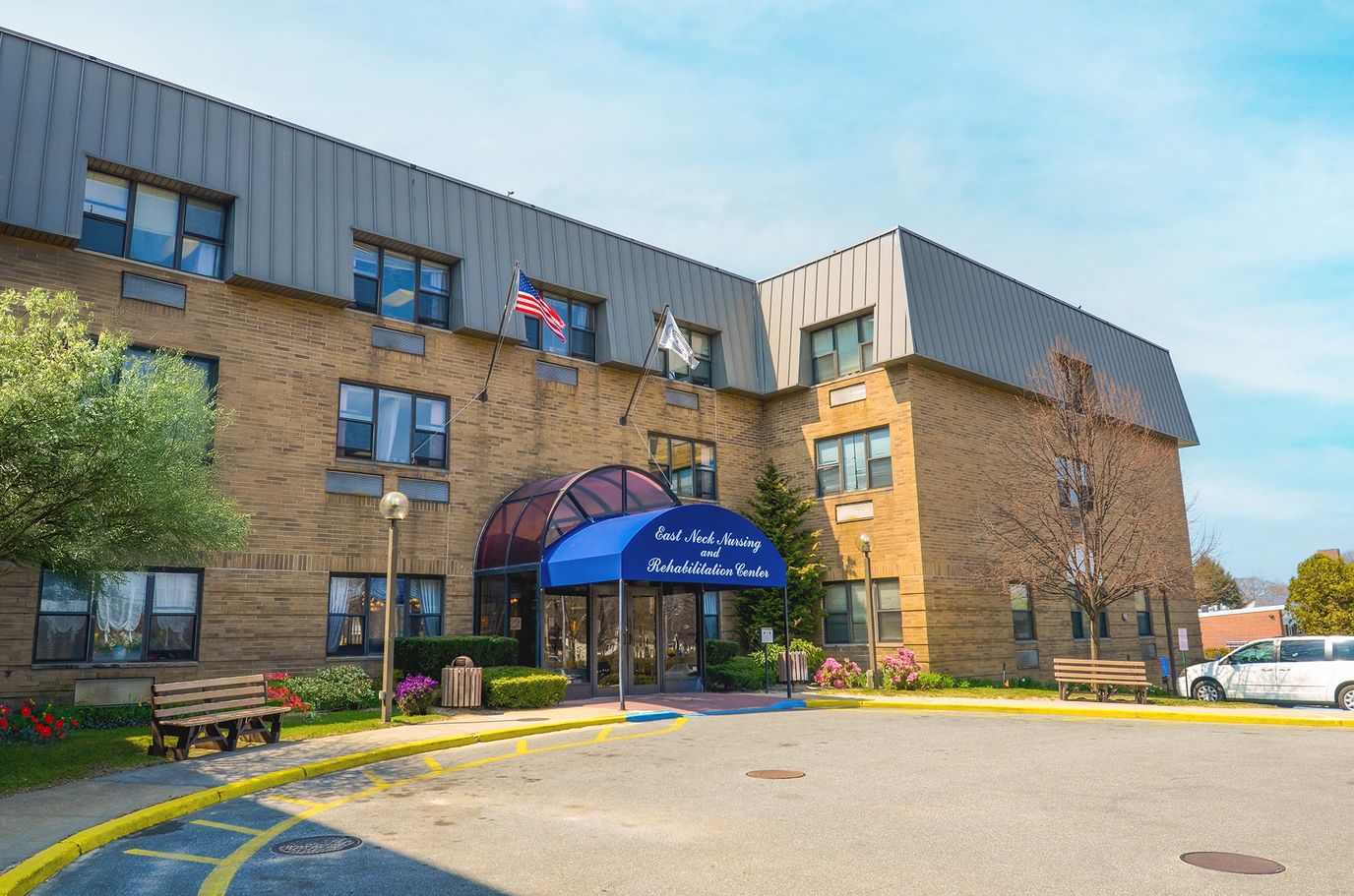 Exterior view of East Neck Nursing & Rehabilitation Center entrance