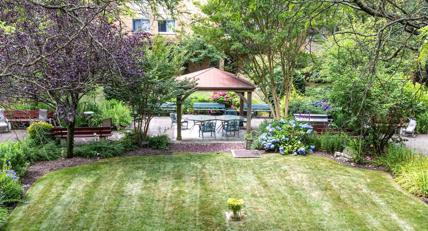 Beautiful outdoor garden with seating areas and gazebo