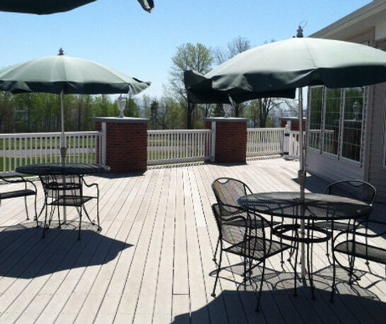Outdoor patio area with tables and umbrellas