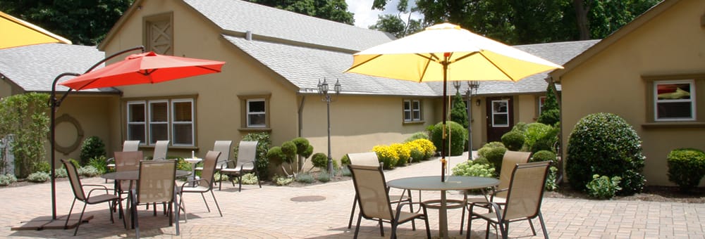 Outdoor patio area with umbrellas and seating