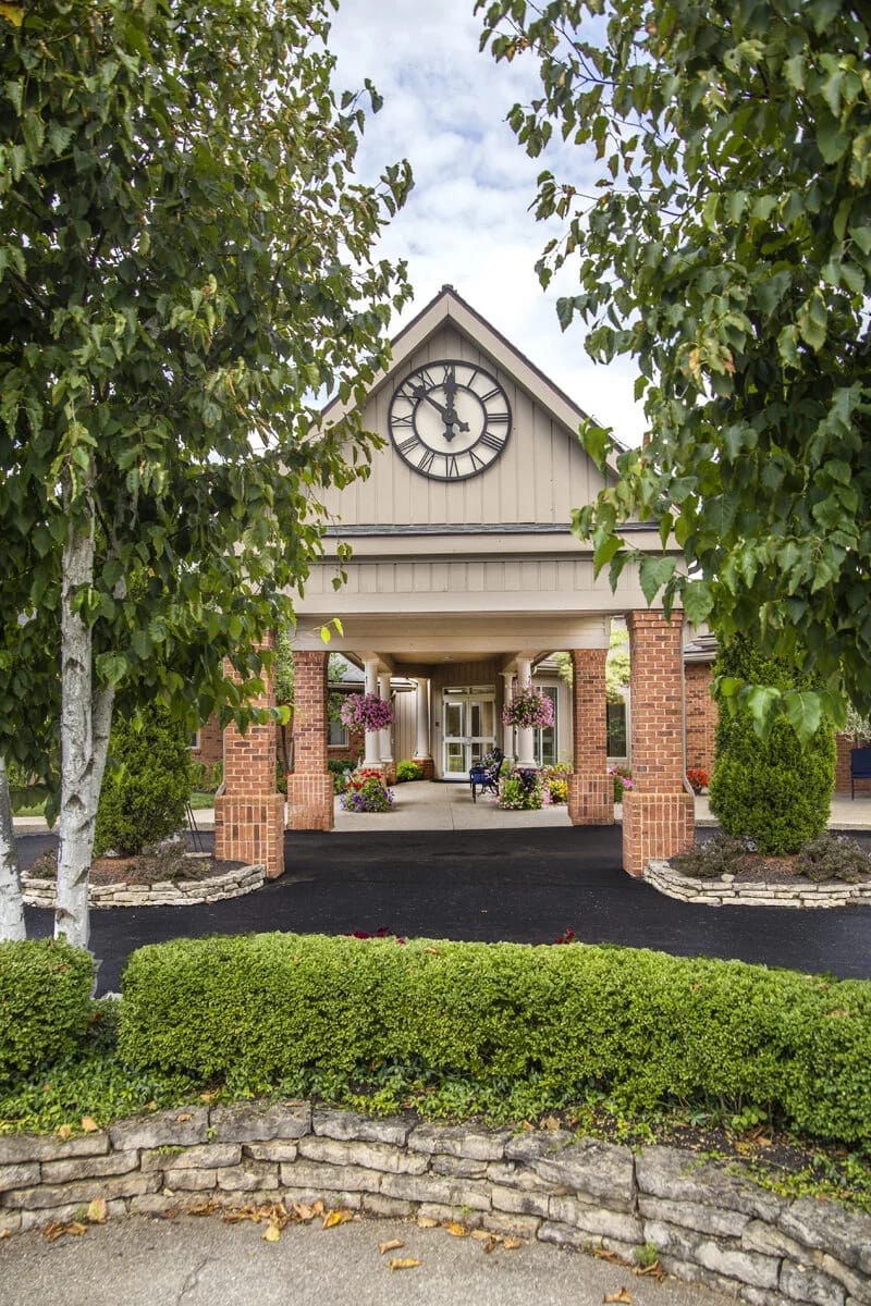 Exterior view of a nursing home entrance with landscaping