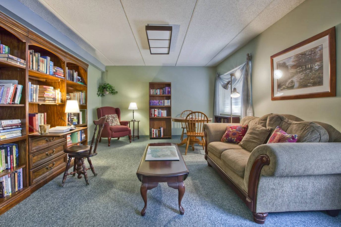 Cozy common area with bookshelves and seating