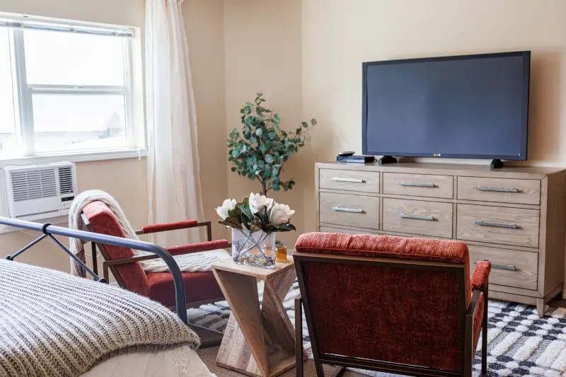 Cozy interior of a private resident room with furniture
