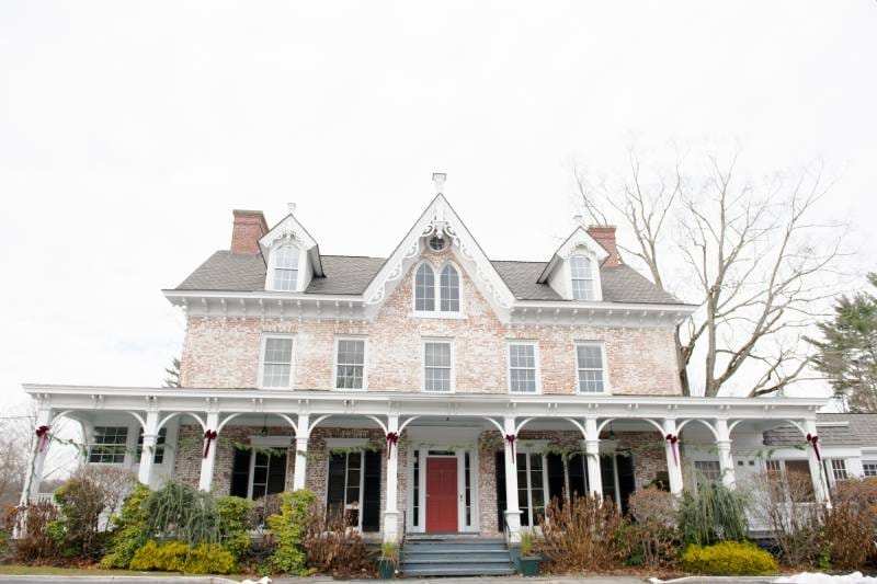 Exterior view of a historic building with a porch