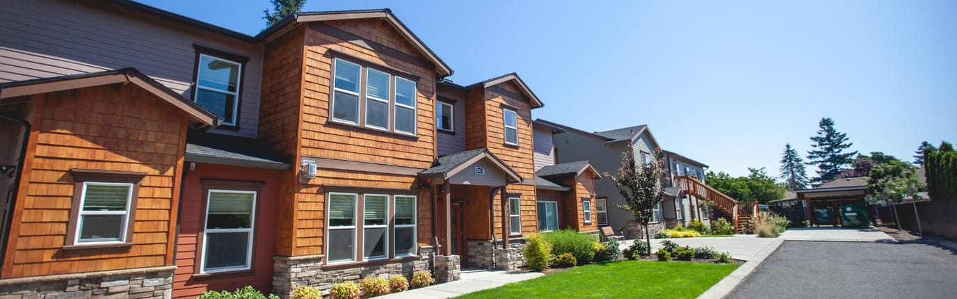 Exterior view of a residential facility with gardens