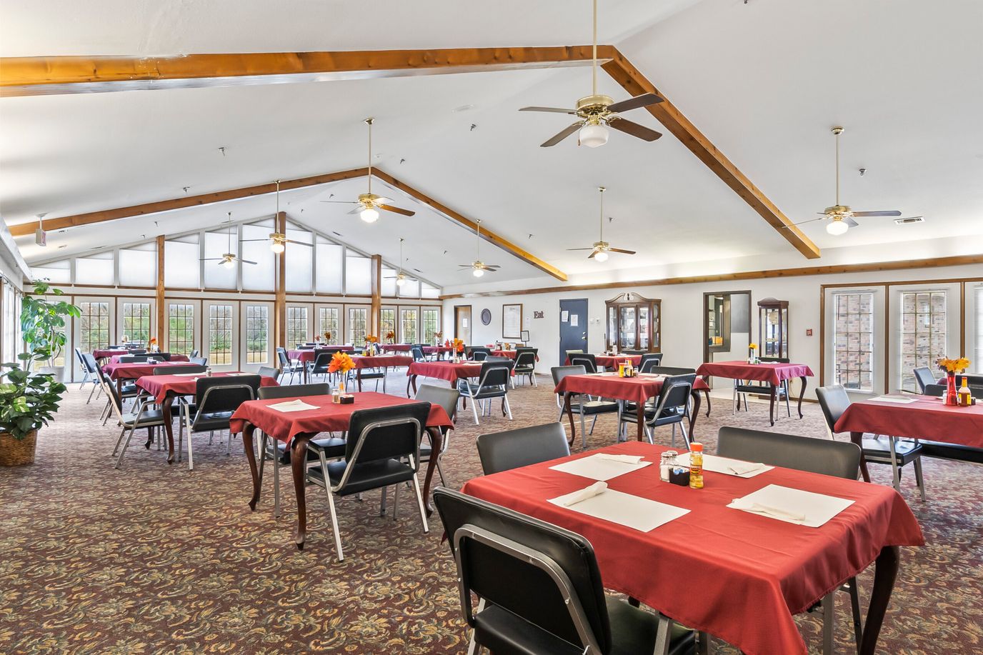 Interior view of a dining room with tables set up