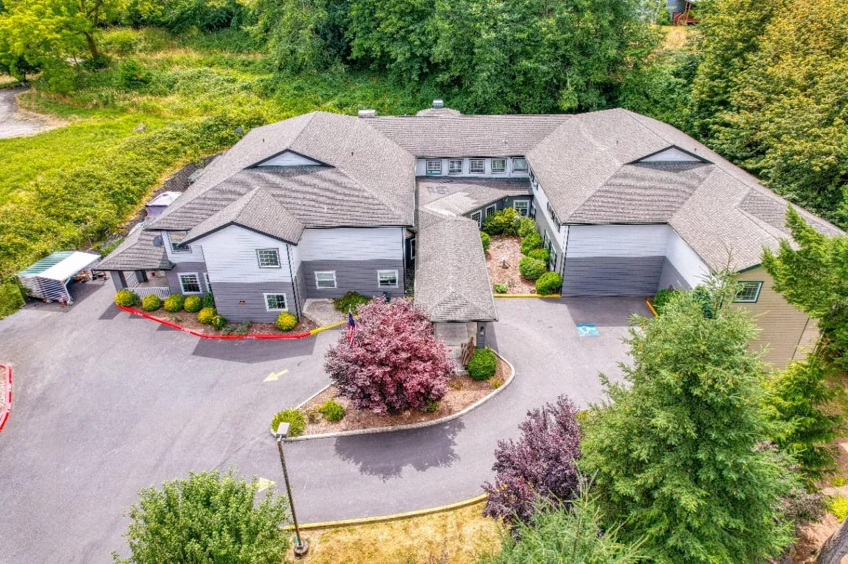 Aerial view of the facility building surrounded by greenery