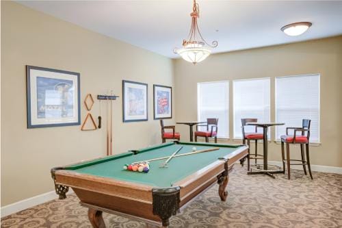 Billiards table in a brightly lit common area