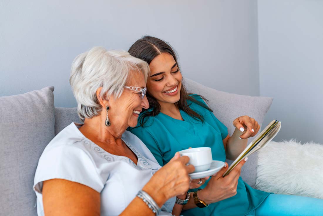 A caregiver and a resident sharing a smile