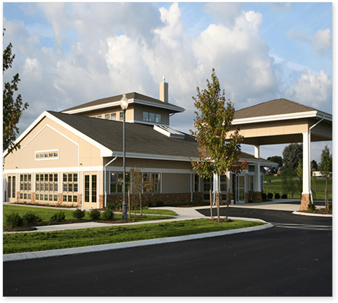 Exterior view of the senior living facility with garden