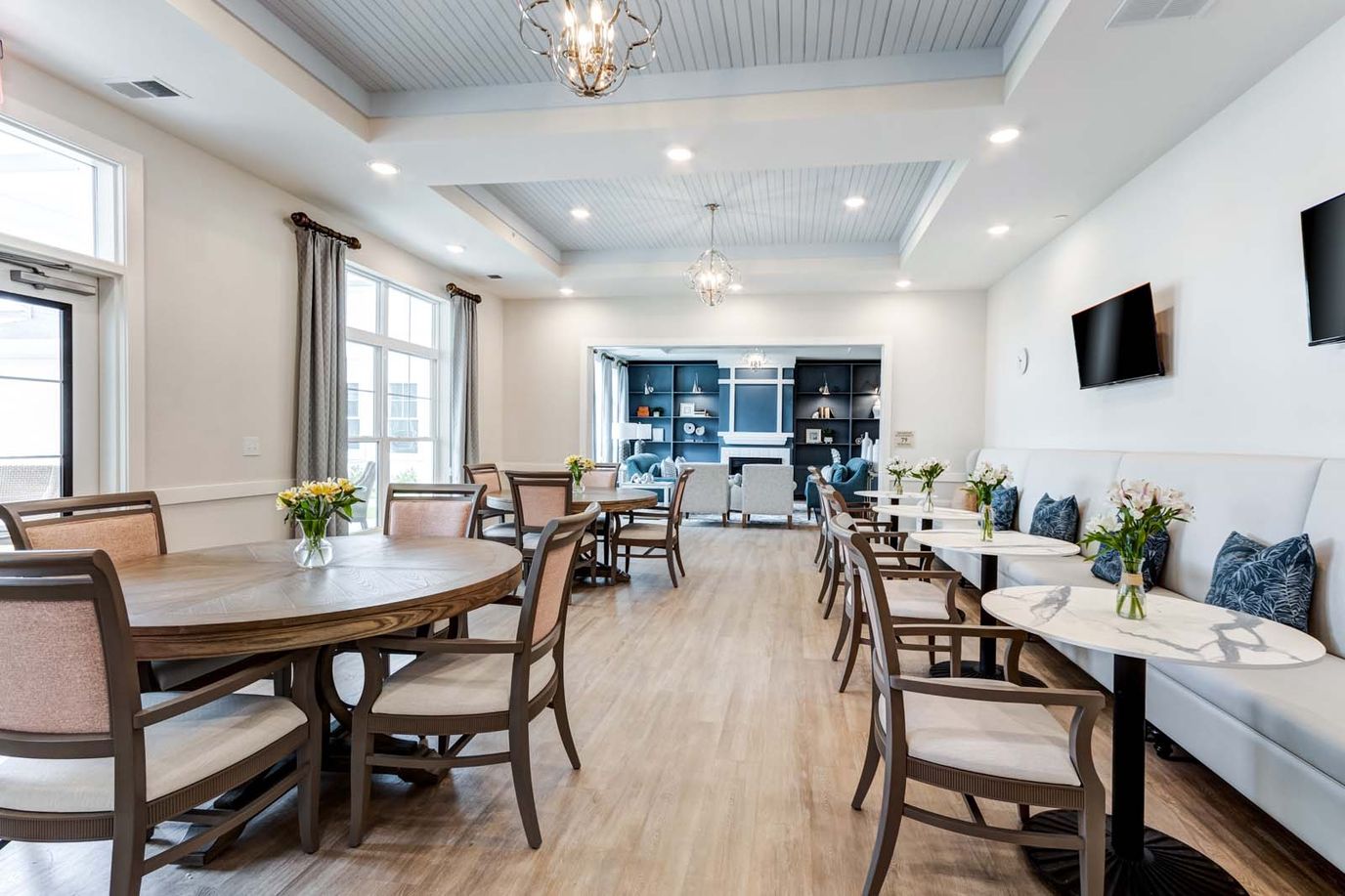Bright common area with tables and chairs