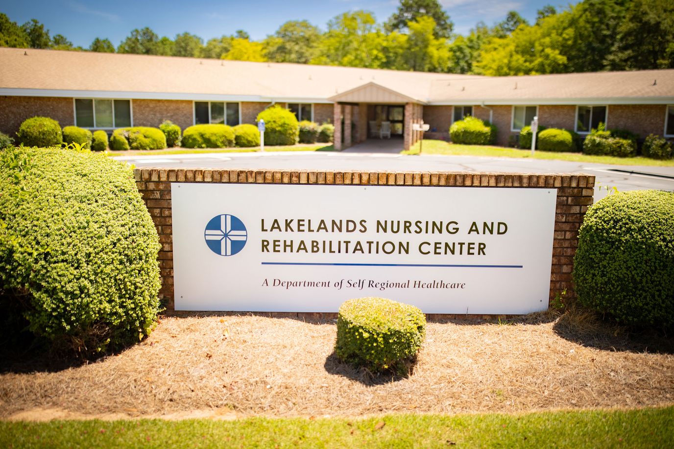 Exterior view of Lakelands Nursing and Rehabilitation Center sign