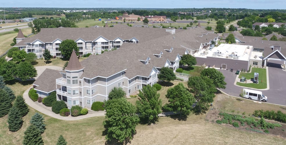 Trail Ridge Senior Living Community, assisted living in Sioux Falls, SD — Aerial view of a senior living community complex with greenery