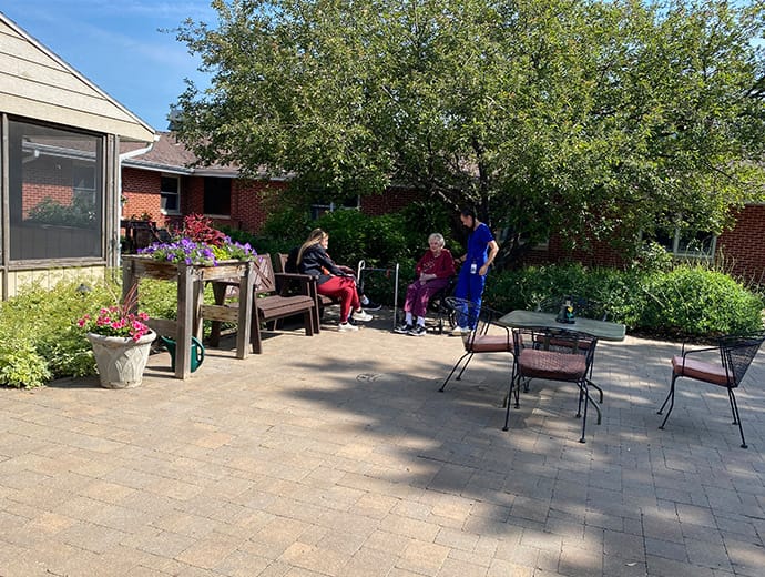 Residents enjoying the outdoor space in a garden area