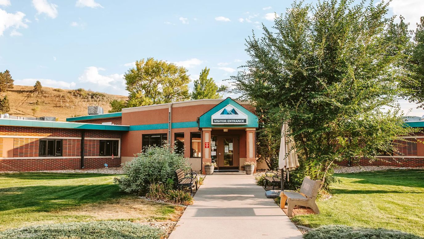 Exterior view of the facility entrance with landscaping