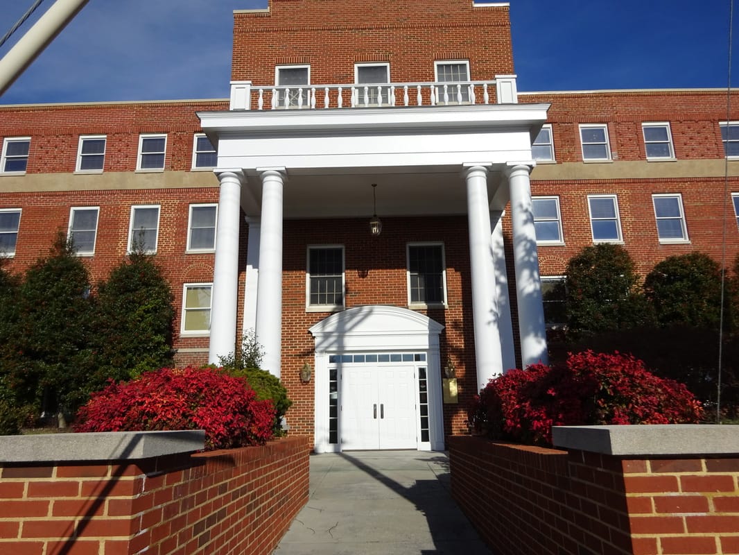 Facade of The Lexington with blooming flowers