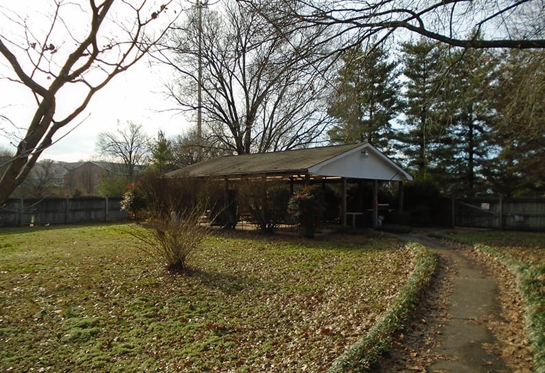 Outdoor view of a small pavilion in the facility garden
