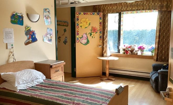 Cozy resident room with colorful decor and window view