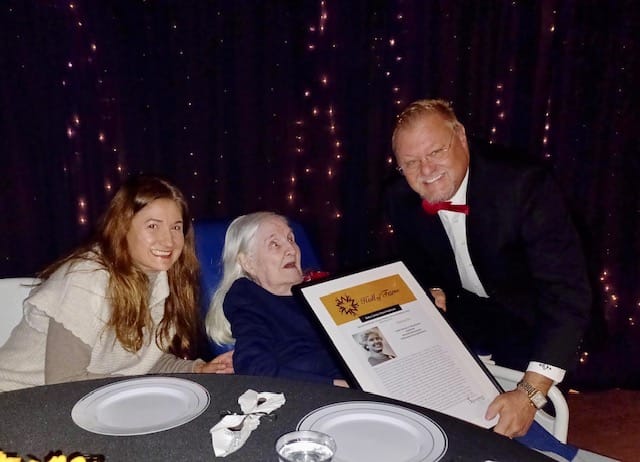 Residents celebrating with staff at a special event