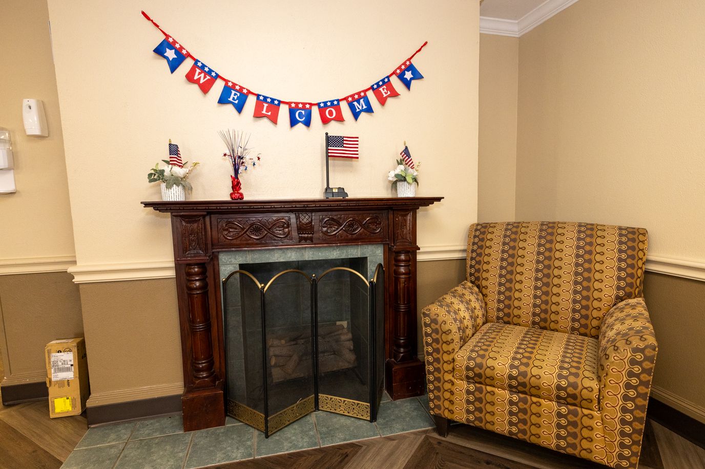 Cozy interior corner with a welcome banner and a chair