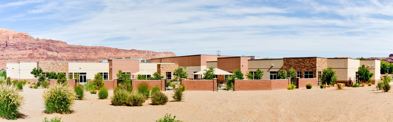 Exterior view of Canyonlands Care Center surrounded by landscaping