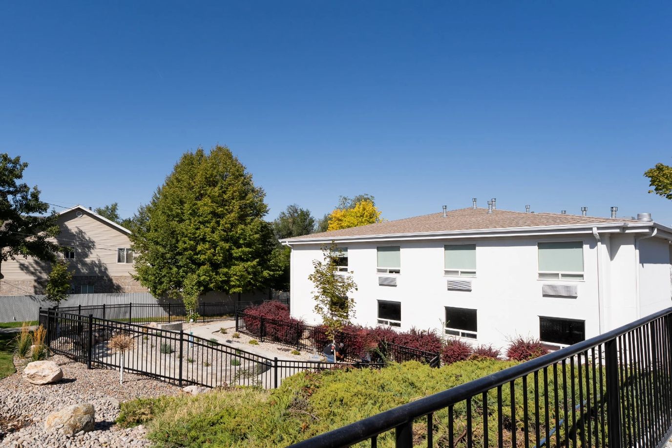 Exterior view of The Beaumont facility with landscaping