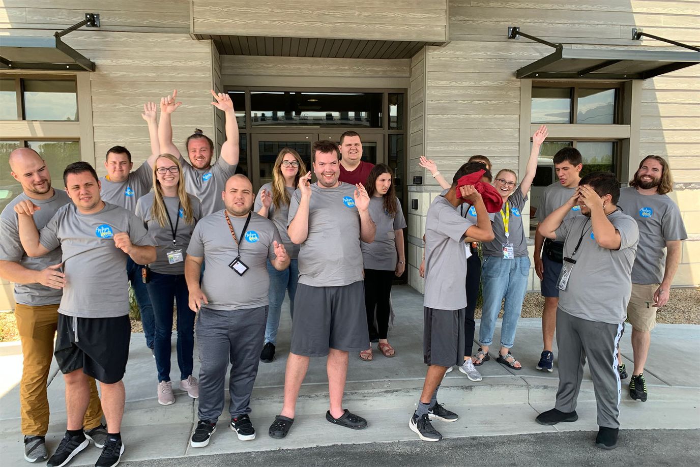 Staff and residents celebrating outside the facility