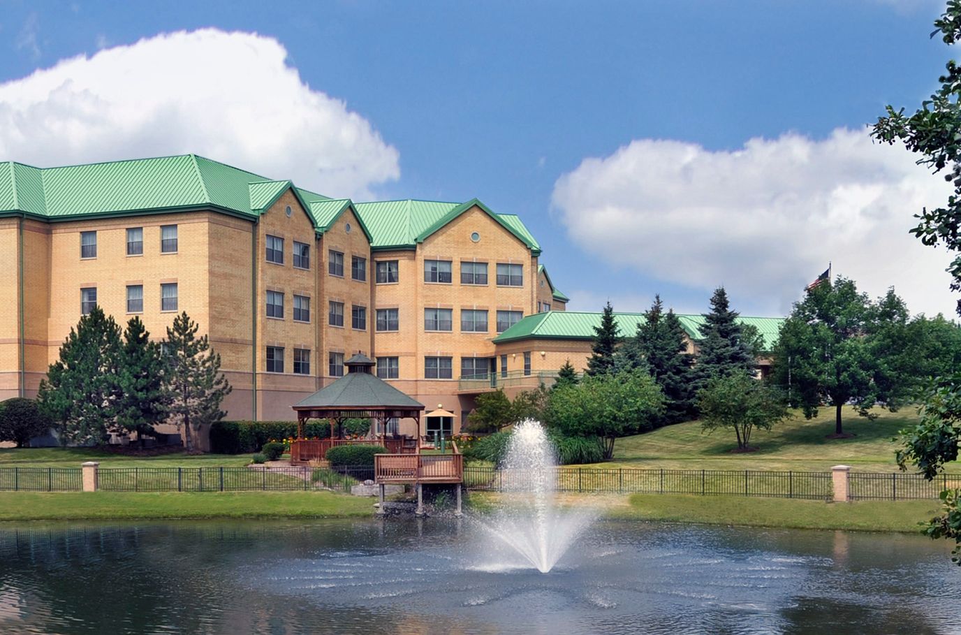 Exterior view of Alden Estates by the pond