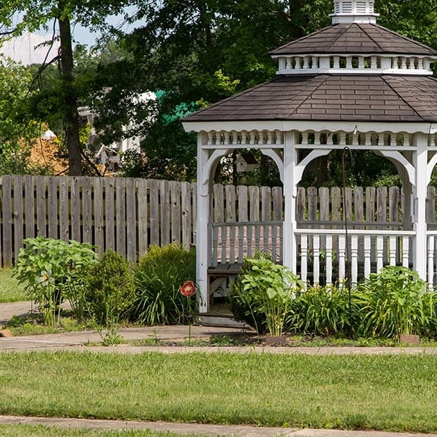 A gazebo in a landscaped outdoor area