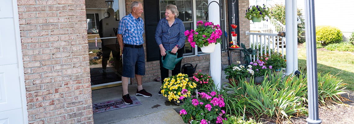 Residents chatting outside with flowers