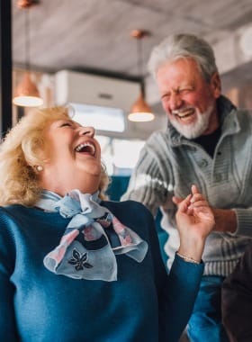 Discovery Village at the West End, assisted living in Richmond, VA — Elderly couple enjoying a joyful moment together