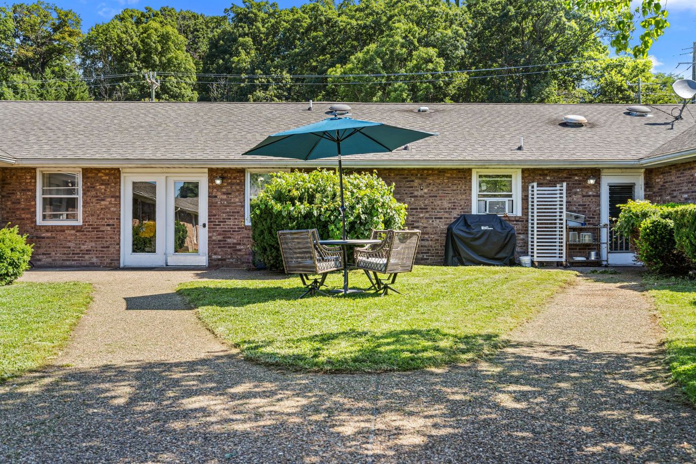 Outdoor seating area with tables and chairs