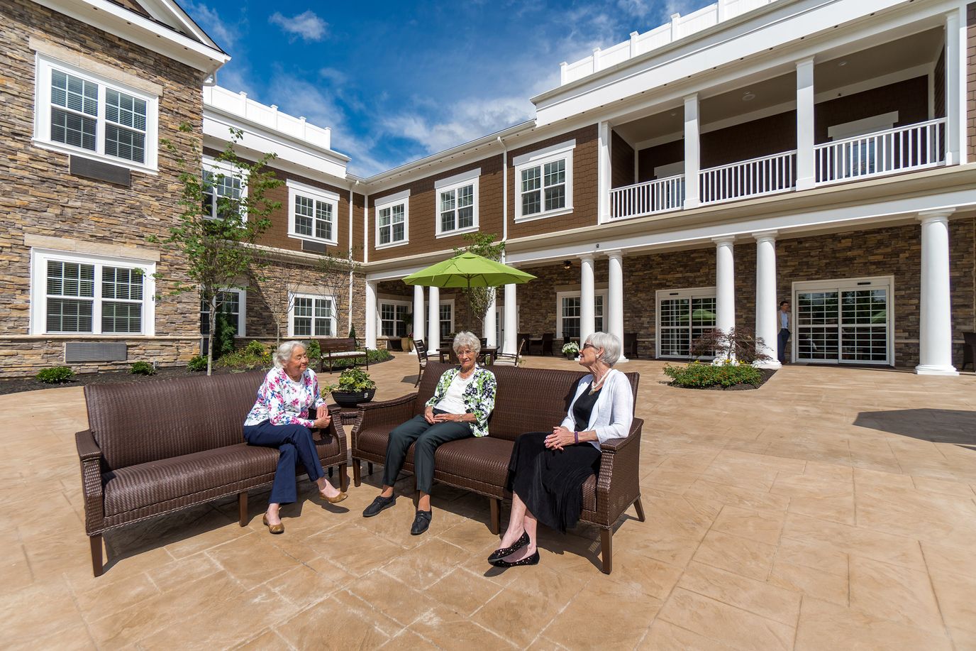 Residents enjoying time outdoors in a courtyard area