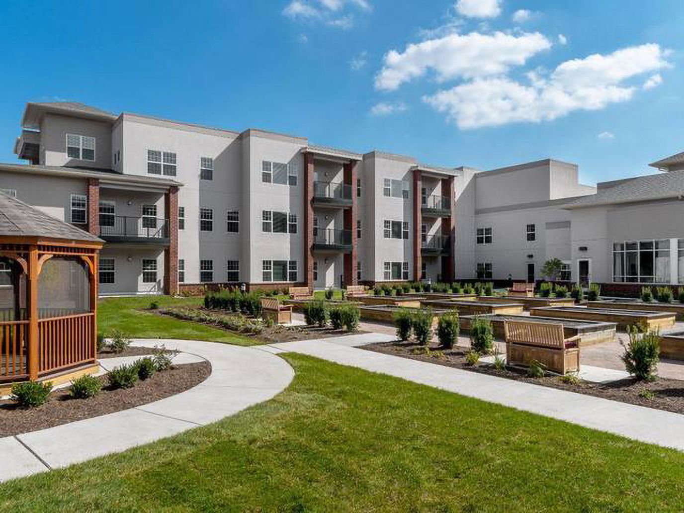 Exterior view of the facility with landscaped garden.