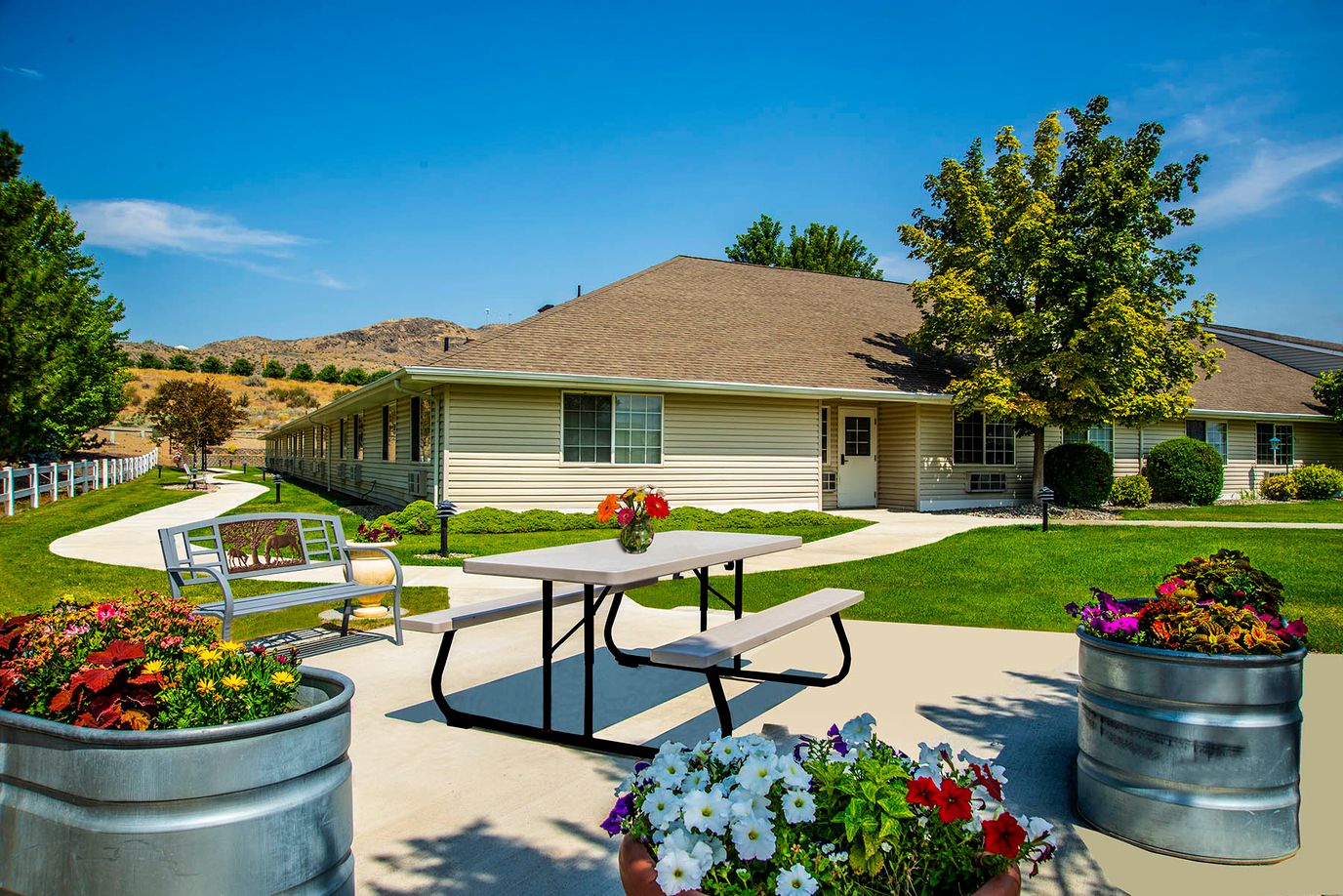Outdoor area with seating and landscaped gardens