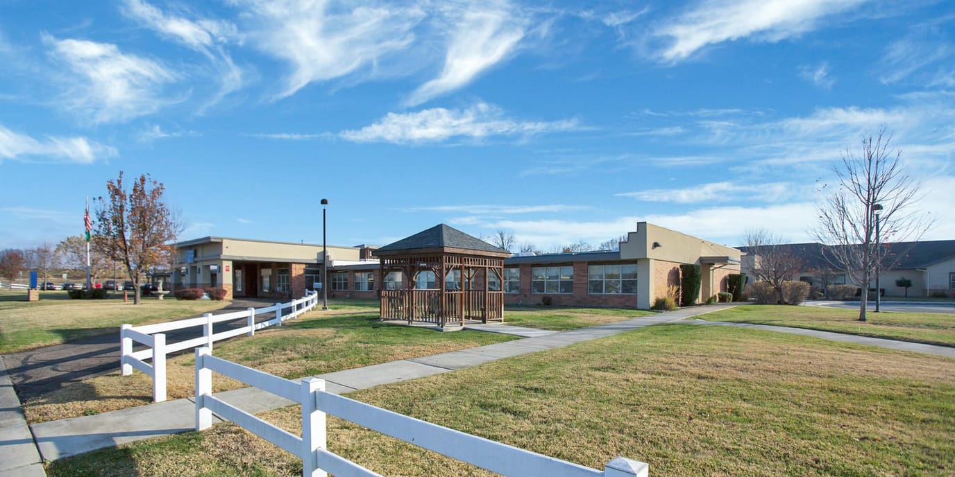 Exterior view of Sunnyside Care's building and gazebo