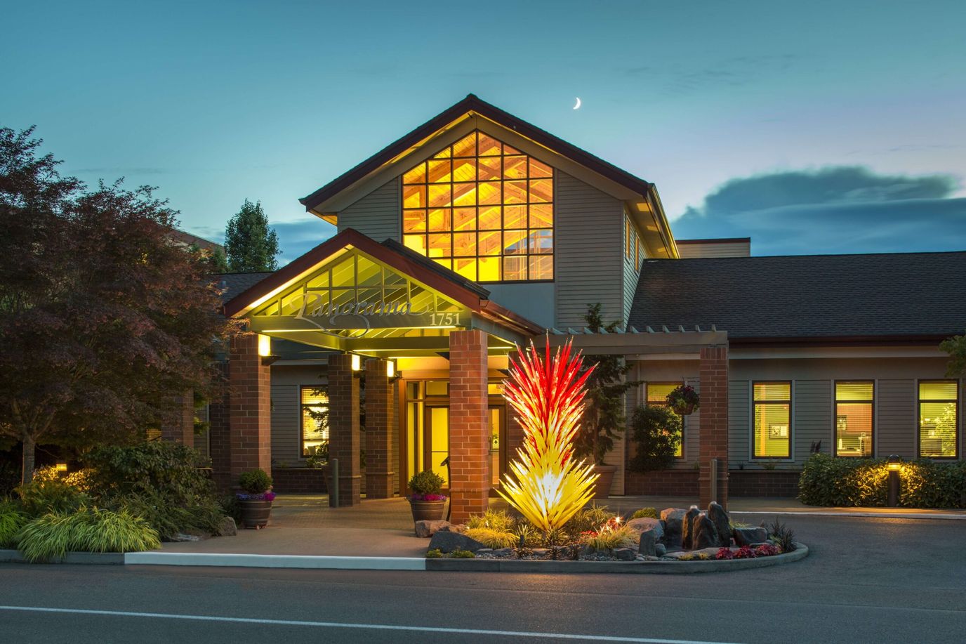 Exterior view of the facility with artistic landscaping