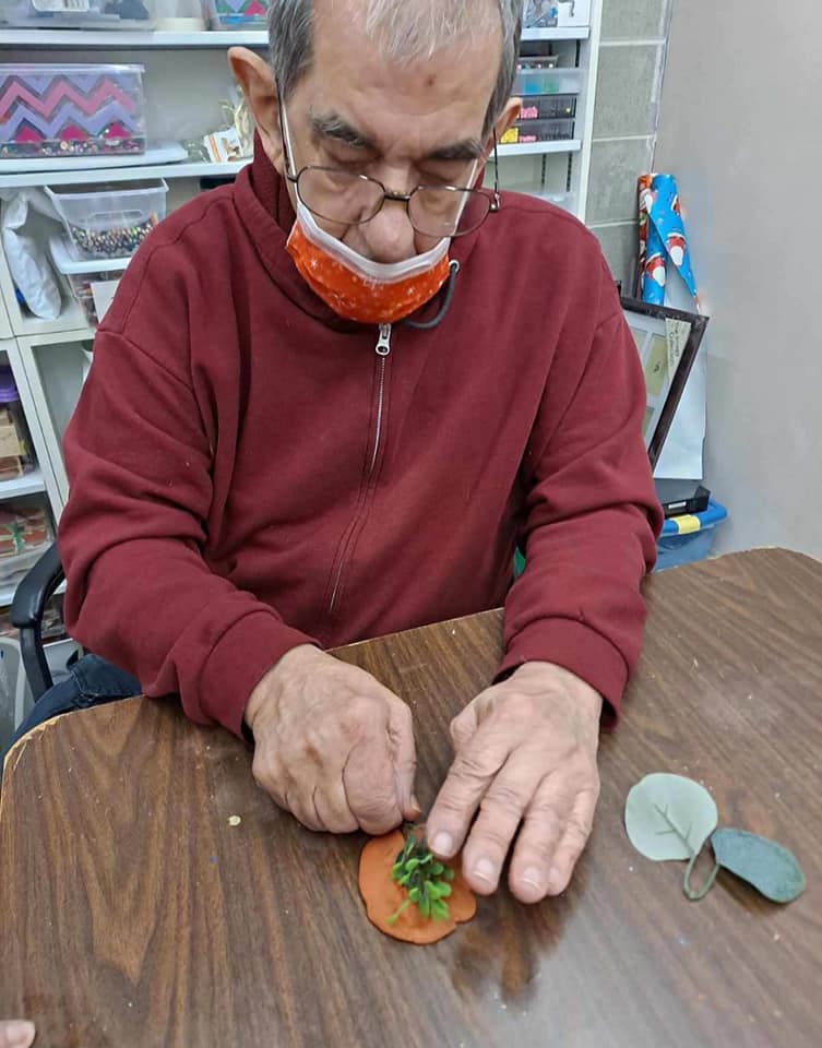 A senior resident engaged in a craft activity