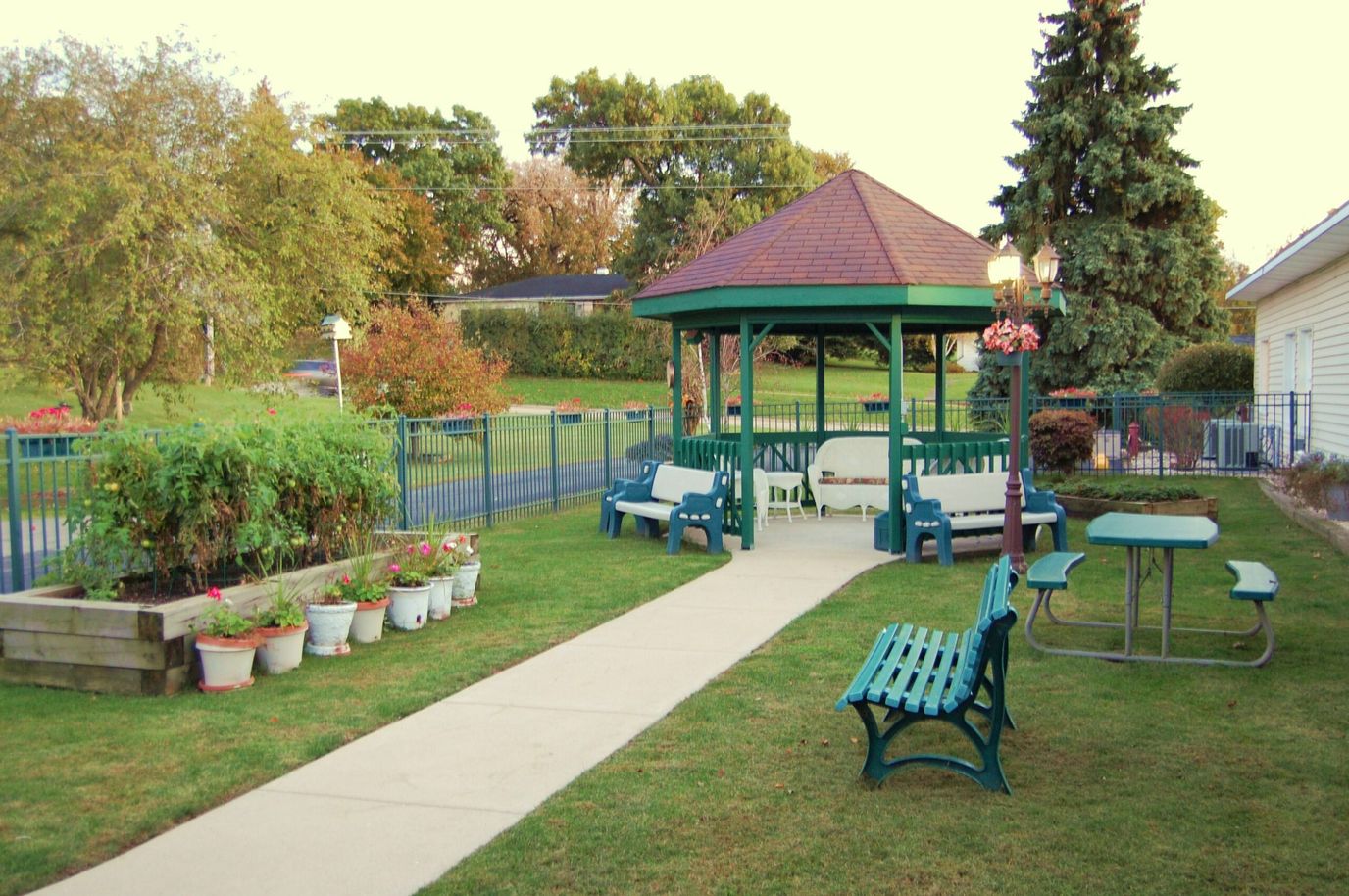 A serene outdoor area with a gazebo and seating
