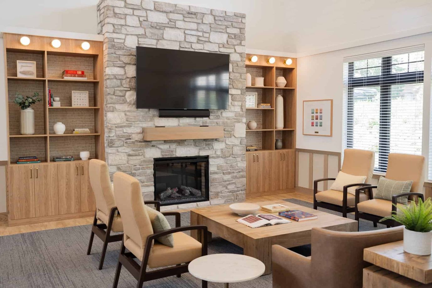 Bright common area with a fireplace and seating
