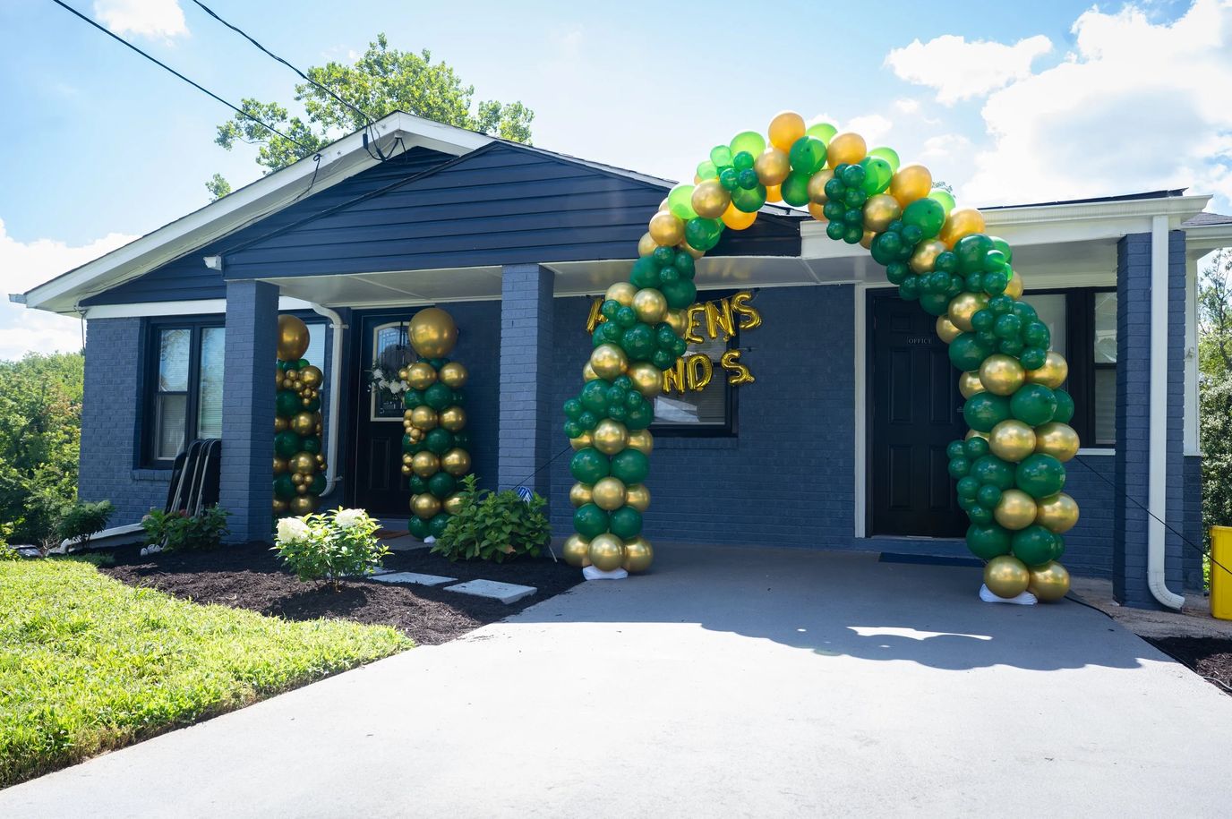 Exterior view of facility entrance with balloon arch
